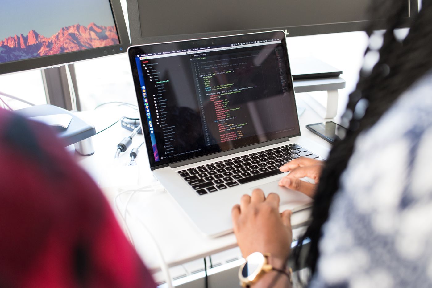 Developers building software on a laptop