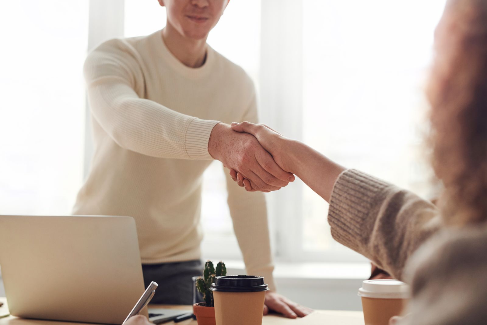Two people reviewing a product plan at a desk